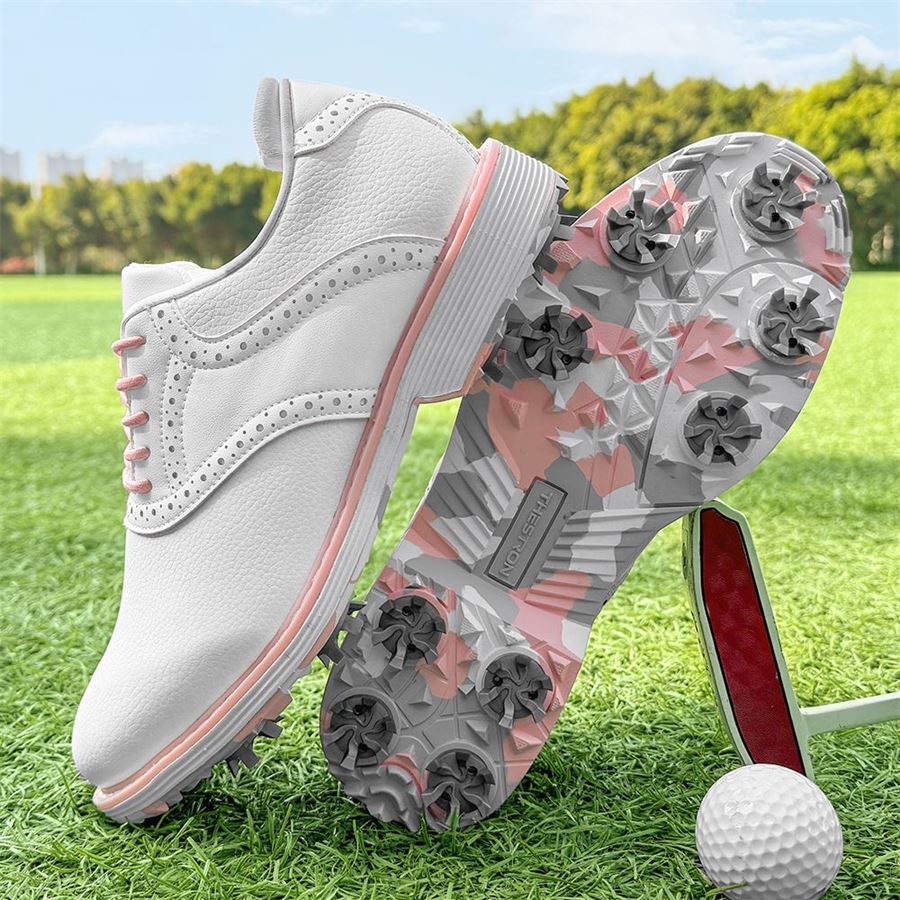 Women's Saddle Spiked Golf Shoe on the golf course, view 1
