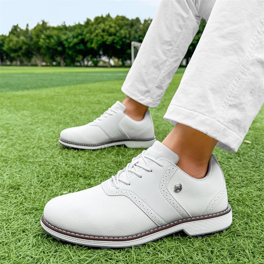 Heritage Saddle Spiked Golf Shoe on the golf course, view 6